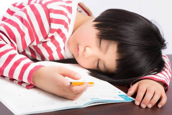 Kid asleep while doing homework